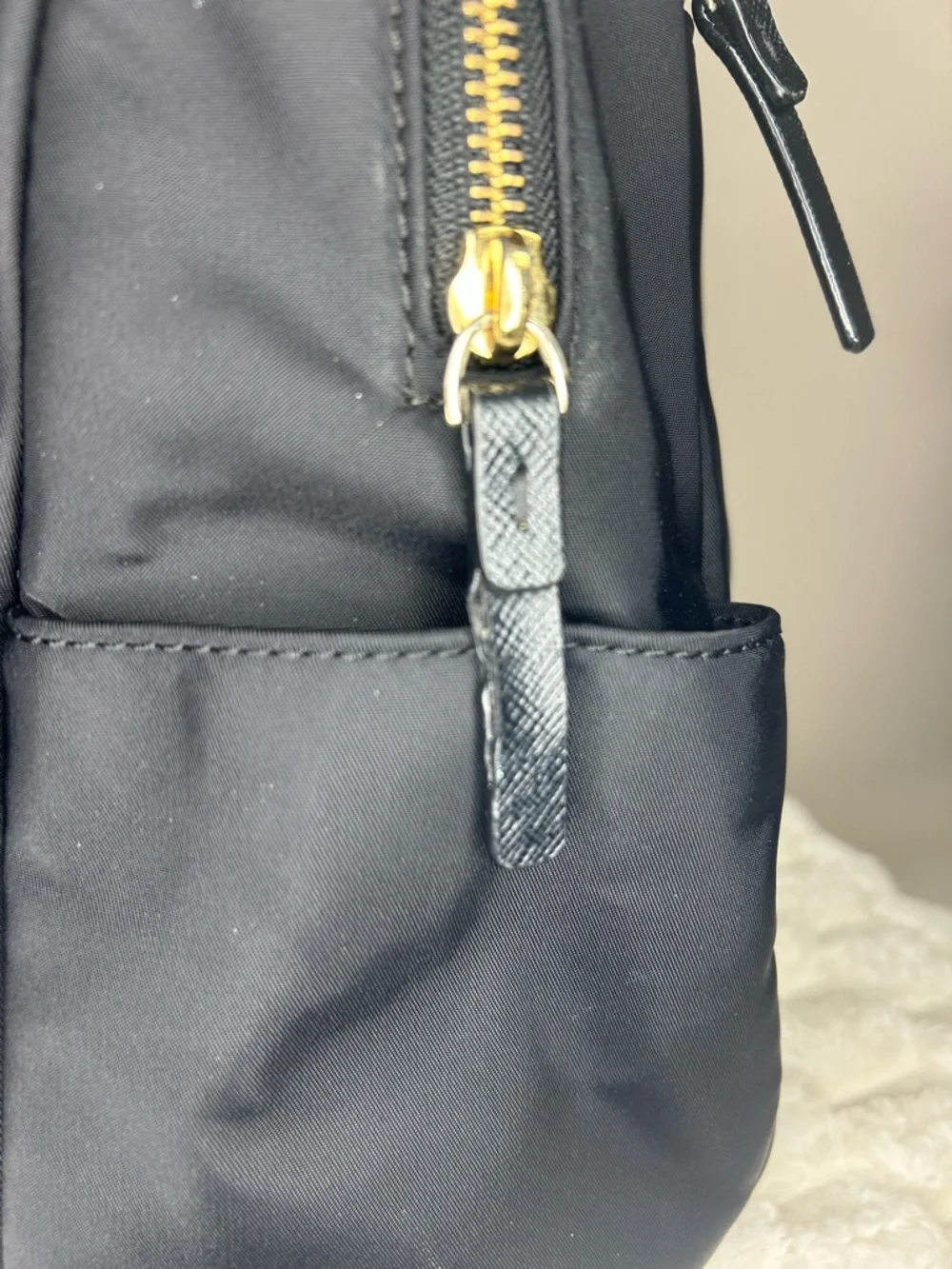 Kate Spade Blake Ave black nylon mini backpack with gold hardware
